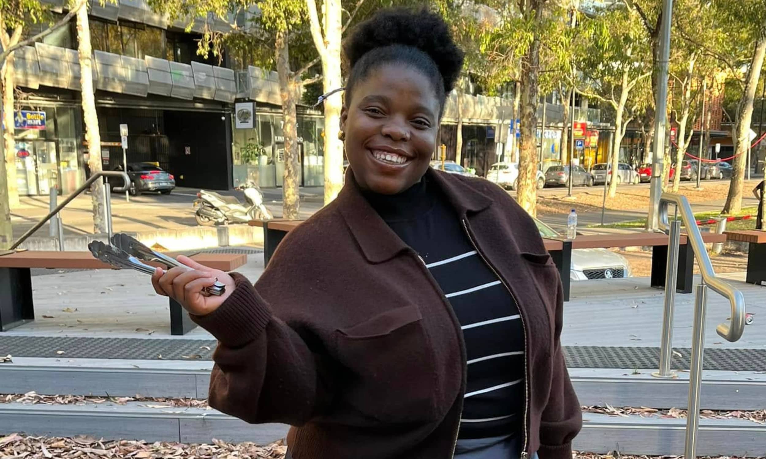 Smiling girl with tongs